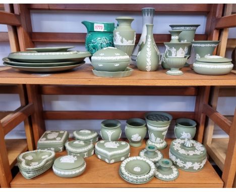 A large collection of Wedgewood green Jasperware; together with another Wedgwood Jasperware vase, 19cm high; and another Wedg