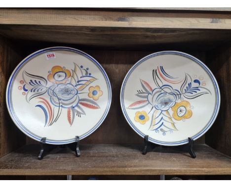 A pair of 1930s Poole Pottery chargers, each inscribed to base 'W.T.L.&amp;S., 1939', 32cm diameter. (2)
