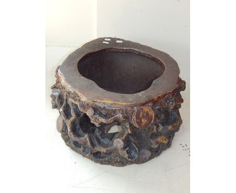 A 19th century salt glazed plant stand, modelled in the form of gnarled tree trunk. D. 51cm