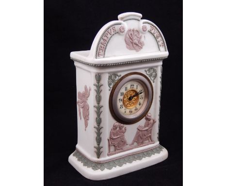 An early 20th century Wedgwood three colour Jasperware mantel clock, with figural decoration in lilac, and inscription Tempus