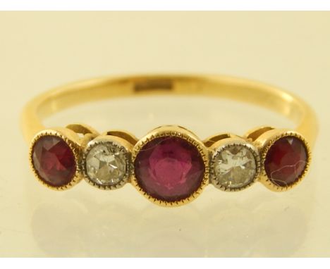 An 18ct yellow gold rubover diamond and ruby set ring.