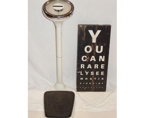 A set of vintage medical scales, together with an optician style wall plaque. 