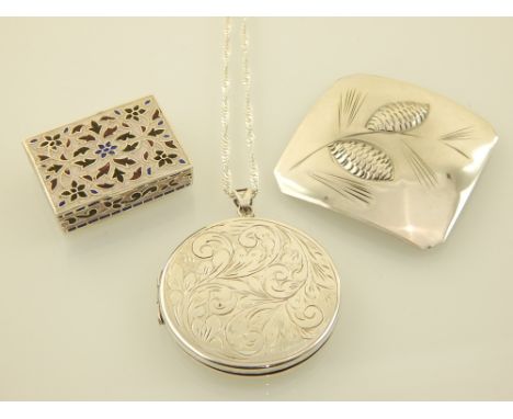 A silver and enamelled snuff box, together with a silver brooch, and a silver locket pendant suspended on a silver chain. (3)