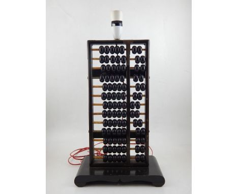 A vintage lacquered wood abacus, converted to a lable lamp with associated base and bayonet bulb fitting. H. 50cm