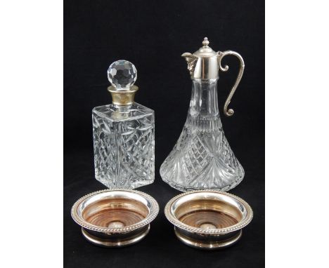 A modern silver mounted spirit decanter, together with a plate mounted claret jug, and a pair of silver plated bottle coaster