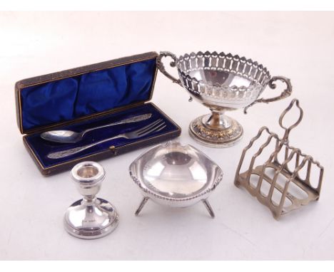 A modern silver desk candlestick, a white metal bowl on three peg feet stamped Silver, a George V silver plated christening s