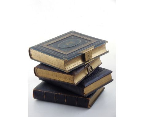 Four Victorian photograph albums containing some illustrated pages and many monochrome portrait cards including two unusual e