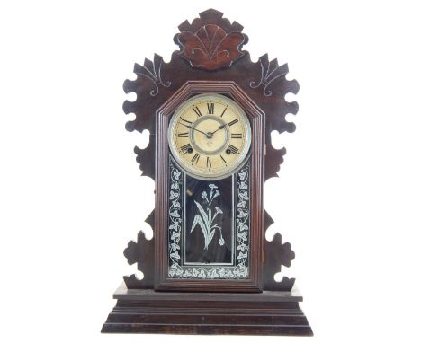 A late 19th century Ansonia mantel clock, the fretwork arched case with a glazed panel. H. 59cm