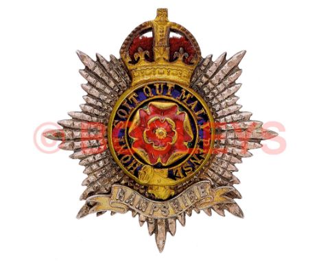 Hampshire Regiment Officer's cap badge circa 1902-47. A fine die-cast example. Cut silver star mounted with gilt crowned pier