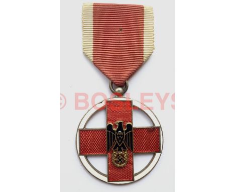 German. Third Reich Red Cross Medal A good example. Within a narrow white circlet, a red translucent enamel Geneva Cross moun