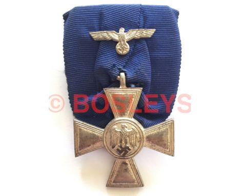 German Third Reich Army 18 year Long Service Cross. A good scarce silver cross with eagle and swastika on the obverse, '18' o