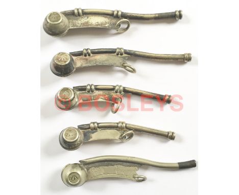 5 x Royal Navy bosun's calls. Nickel plated brass examples. Each end of the barrel shaped bearing WD Broad Arrow on a lined g