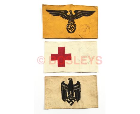 German Third Reich. Selection of 3 armbands. Employed on Reich Service embroidered (black eagle and swastika on yellow) ... R