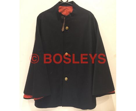 Royal Irish Dragoon Guards Officer's Cloak. A scarce pre 1922 example of fine dark blue melton cloth, with scarlet cotton lin