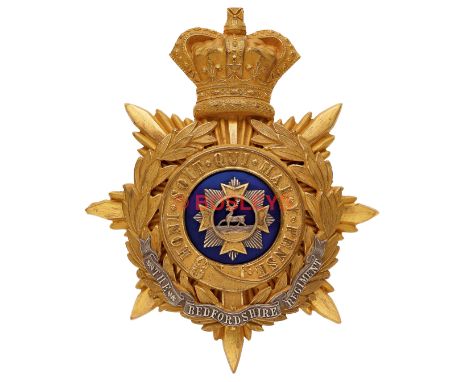 Bedfordshire Regiment Victorian Officer's helmet plate circa 1881-1901. A very fine rich gilt example. Crowned star mounted w