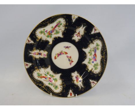 A Royal Worcester cabinet plate 'Old Worcester Scale Blue', painted with exotic birds, bearing paper labels for 'The Worceste