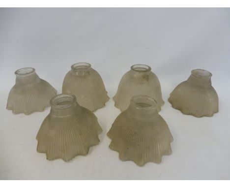 Four matching ribbed glass lamp shades with flared rims and two similar. 