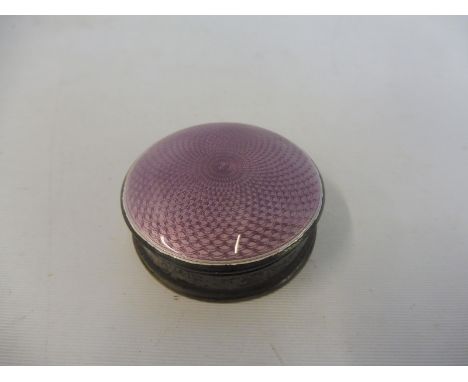 A silver and mauve enamel circular pill pot.