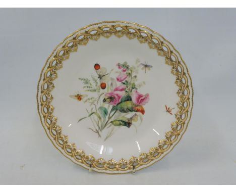 A Royal Worcester cabinet plate with a pierced gilded border and central hand painted floral spray, with various insects flyi