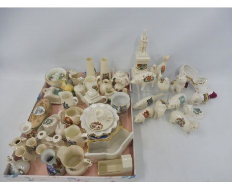 Approximately 55+ pieces of crested china including the Bruce Statue, Stirling, numerous ornaments etc. also two miniature Ro