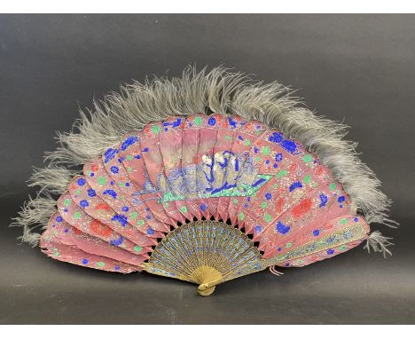 A brass and enamel mounted hand painted feather fan decorated with Chinese figures.