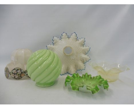 A collection of mostly early 20th Century glass light shades including a vaseline glass example.