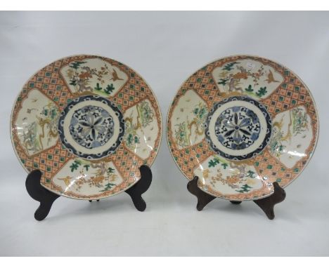 A pair of 19th Century Oriental saucers, each 12" diameter. 