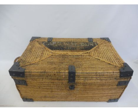 A rectangular wicker trunk with metal corners, would make an ideal toy box.