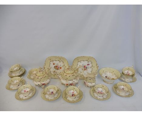 A Victorian 12 setting part tea service decorated with a central hand painted floral spray comprising teapot, sucriere, milk 