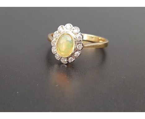 OPAL AND DIAMOND CLUSTER RINGthe central oval cabochon opal in lobed surround set with twelve diamonds, on eighteen carat gol