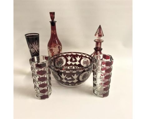 SELECTION OF RUBY FLASH AND ETCHED GLASS PIECEScomprising a wine decanter with vine decoration; another with floral decoratio