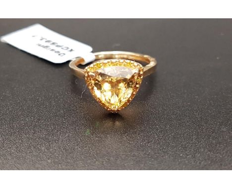 CERTIFIED GOLDEN BERYL AND YELLOW DIAMOND DRESS RINGthe central trillion cut Idar golden Beryl weighing 2.25cts in surround s