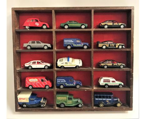 SELECTION OF FIFTEEN SMALL DIE CAST VEHICLESwith examples from Corgi and Matchbox, in a wooden display rack (15) 