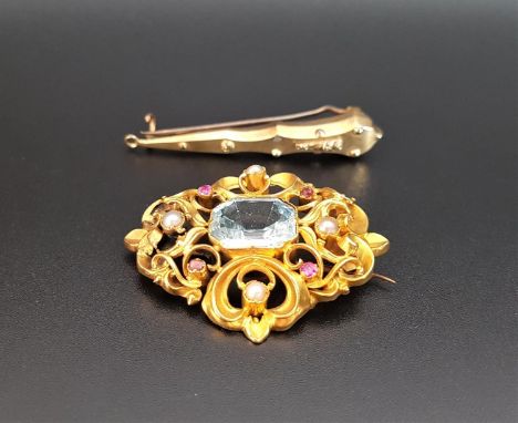 VICTORIAN AQUAMARINE, RUBY AND PEARL BROOCHthe central emerald cut aquamarine in pierced scroll decorated unmarked gold mount