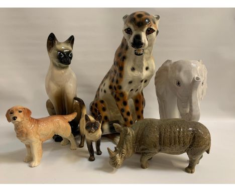 SELECTION OF CERAMIC ANIMALSincluding a large leopard, a white elephant stick stand, two Siamese cat figures, one seated and 