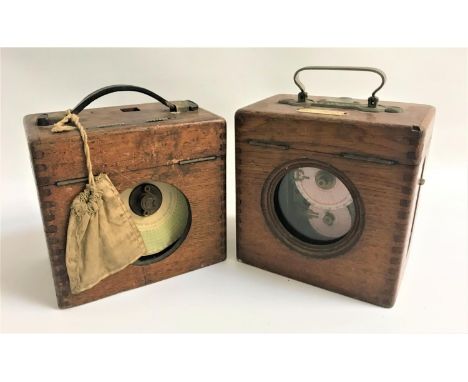 TWO RACING PIGEON CLOCKSboth with outer oak cases, one a Belgian timer, the other The Automatic Timing Clock Co. Ltd (2) 