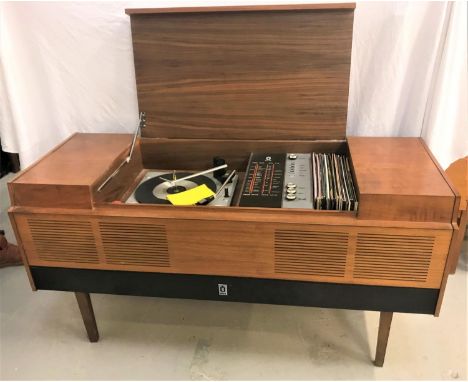 ULTRA MUSIC CENTREin a teak case with a central lift up lid revealing a record player and tuner with a glass panel with Short