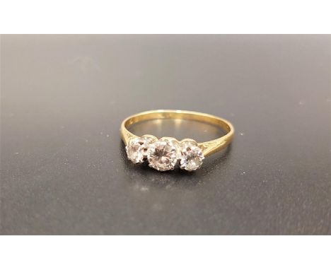 GRADUATED DIAMOND THREE STONE RINGthe round brilliant cut diamonds totaling approximately 0.85cts, on eighteen carat gold sha