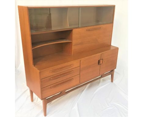 BEITHCRAFT TEAK SIDEBOARDwith a pair of glass sliding upper doors above an open shaped shelf next to a fall flap, the lower s