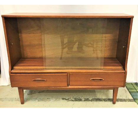 TEAK SIDE CABINETthe pair of glass sliding doors with an adjustable shelf above two short drawers, standing on tapering suppo