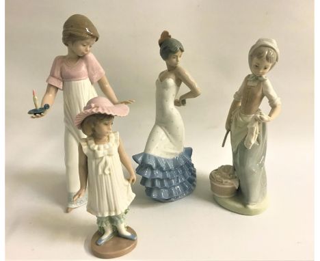 FOUR NAO FIGURINEScomprising a girl with a chamber stick, 26cm high, Flamenco dancer, 24cm high, washer girl, 23cm high and a