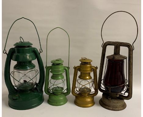 FOUR RAILWAY LANTERNSincluding a Pritchard-Strang Co. Rochester, New York, Prisco #0 with a red glass, 1940's Embury Mfg Co. 