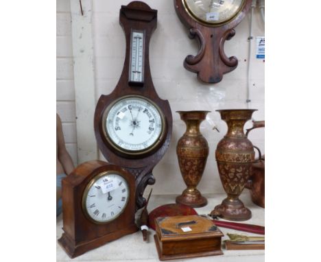 A silver plate Edwardian carved oak aneroid barometer with thermometer, an Edwardian mahogany mantel clock; a pair of brass v