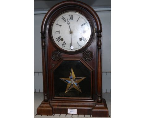 A 19th century American rosewood effect cased arch top mantel clock "Italian No 1", with 8 day striking movement