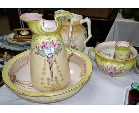 A late Victorian Art Nouveau design floral 5-piece jug and bowl set and a similar jug