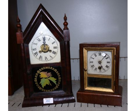 A 19th century American mantel clock in mahogany Gothic arch case, white dial, painted door, and striking movement; a similar