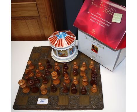 A turned wood weighted chess set, height of king 3"; a German porcelain musical carousel