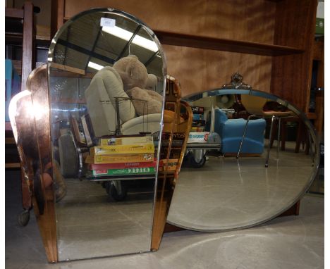 An Art Deco peach framed wall mirror; an oval bevelled edge wall mirror