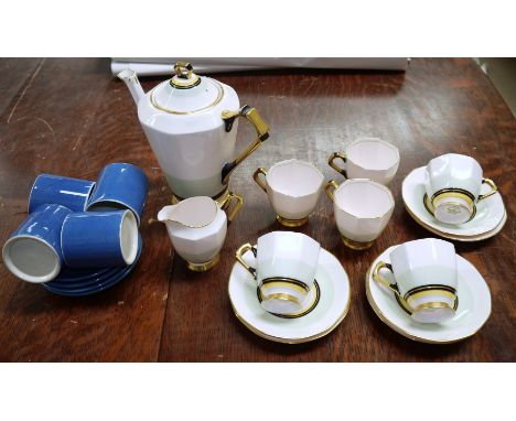 An Art Deco Tuscan part coffee set and 4 Moorcroft cups and saucers, pale blue 