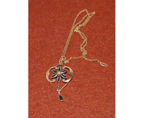 An Art Nouveau sapphire and seed pearl pendant stamped 18ct on chain stamped 9ct (gross 3.4gms)